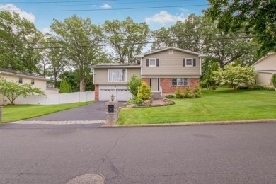 Meticulously maintained split-level home in Elmsford with major on Elmwood Country Club in New York - for sale on GolfHomes.com, golf home, golf lot
