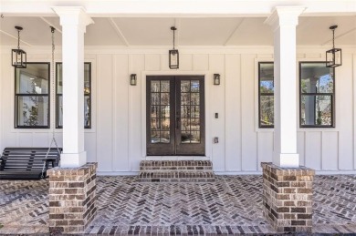 Nestled on a breathtaking 0.76-acre lot in the prestigious on Harbor Club Golf and Country Club in Georgia - for sale on GolfHomes.com, golf home, golf lot