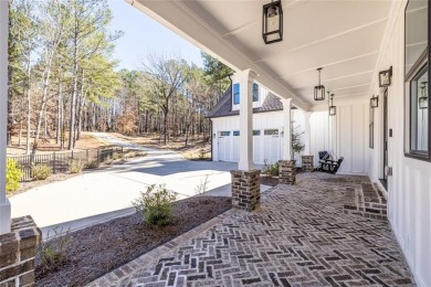 Nestled on a breathtaking 0.76-acre lot in the prestigious on Harbor Club Golf and Country Club in Georgia - for sale on GolfHomes.com, golf home, golf lot
