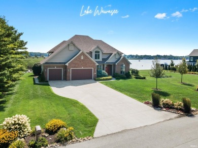 Experience refined waterfront living on Lake Wawasee in this for sale on GolfHomes.com
