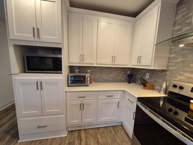 This is stunning and a must see, located in Beach Cove 55+ on Pelican Pointe 9 Hole Course in Florida - for sale on GolfHomes.com, golf home, golf lot