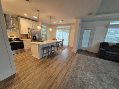 This is stunning and a must see, located in Beach Cove 55+ on Pelican Pointe 9 Hole Course in Florida - for sale on GolfHomes.com, golf home, golf lot