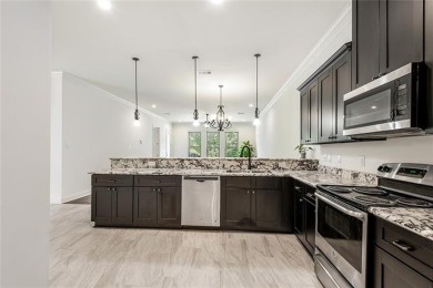 STUNNING 3/2 WITH NO CARPET, OPEN FLOOR PLAN, GRANITE, STAINLESS on Carter Plantation Golf Course in Louisiana - for sale on GolfHomes.com, golf home, golf lot