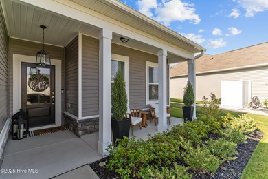 Contemporary coastal elegance defines this nearly new Eagle Run on Crow Creek Golf Club in North Carolina - for sale on GolfHomes.com, golf home, golf lot