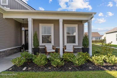 Contemporary coastal elegance defines this nearly new Eagle Run on Crow Creek Golf Club in North Carolina - for sale on GolfHomes.com, golf home, golf lot