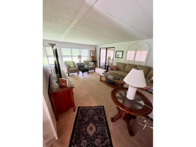 This beautiful two-bedroom, two-bath home is located in the on Pine Lakes Country Club in Florida - for sale on GolfHomes.com, golf home, golf lot
