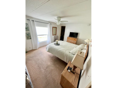 This beautiful two-bedroom, two-bath home is located in the on Pine Lakes Country Club in Florida - for sale on GolfHomes.com, golf home, golf lot
