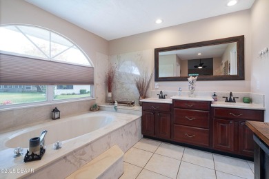 Beautiful golf course home on an oversized lot in the on Plantation Bay Golf and Country Club in Florida - for sale on GolfHomes.com, golf home, golf lot