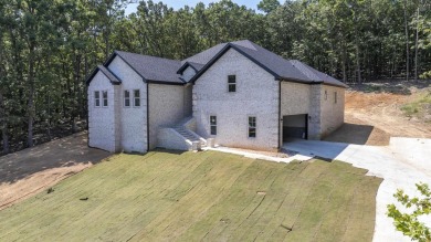This stunning 5-bedroom, 3-bath brick home offers modern design on The Course At Eagle Mountain in Arkansas - for sale on GolfHomes.com, golf home, golf lot