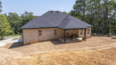 This stunning 5-bedroom, 3-bath brick home offers modern design on The Course At Eagle Mountain in Arkansas - for sale on GolfHomes.com, golf home, golf lot