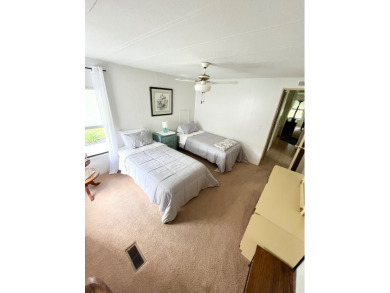 This beautiful two-bedroom, two-bath home is located in the on Pine Lakes Country Club in Florida - for sale on GolfHomes.com, golf home, golf lot