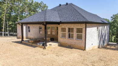 This stunning 5-bedroom, 3-bath brick home offers modern design on The Course At Eagle Mountain in Arkansas - for sale on GolfHomes.com, golf home, golf lot
