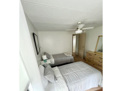 This beautiful two-bedroom, two-bath home is located in the on Pine Lakes Country Club in Florida - for sale on GolfHomes.com, golf home, golf lot
