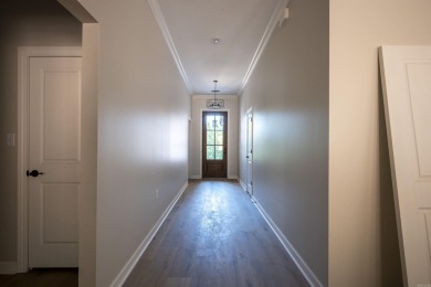 This stunning 5-bedroom, 3-bath brick home offers modern design on The Course At Eagle Mountain in Arkansas - for sale on GolfHomes.com, golf home, golf lot