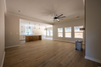 This stunning 5-bedroom, 3-bath brick home offers modern design on The Course At Eagle Mountain in Arkansas - for sale on GolfHomes.com, golf home, golf lot