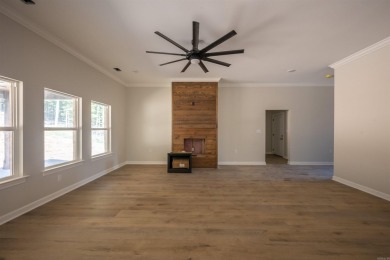 This stunning 5-bedroom, 3-bath brick home offers modern design on The Course At Eagle Mountain in Arkansas - for sale on GolfHomes.com, golf home, golf lot