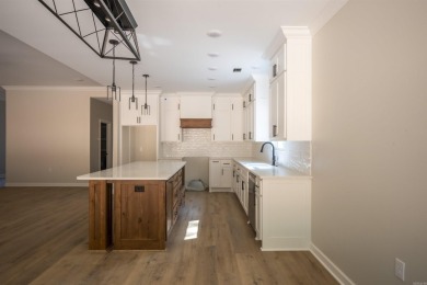 This stunning 5-bedroom, 3-bath brick home offers modern design on The Course At Eagle Mountain in Arkansas - for sale on GolfHomes.com, golf home, golf lot
