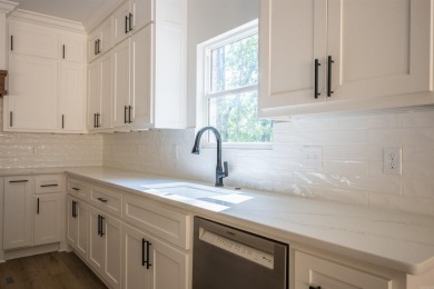 This stunning 5-bedroom, 3-bath brick home offers modern design on The Course At Eagle Mountain in Arkansas - for sale on GolfHomes.com, golf home, golf lot
