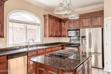 Welcome to your executive four-bedroom grand home located on the on The Oaks Golf Club in Mississippi - for sale on GolfHomes.com, golf home, golf lot