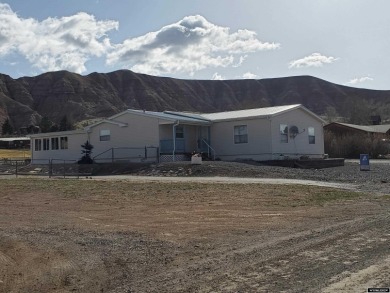 This manufactured home is nicely located in Dubois' Westview on Antelope Hills Golf Course in Wyoming - for sale on GolfHomes.com, golf home, golf lot