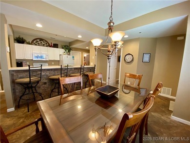 Experience easy lake living in this spacious two-story condo at on Tan-Tar-A Golf Club in Missouri - for sale on GolfHomes.com, golf home, golf lot