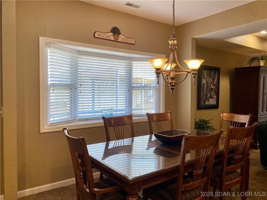 Experience easy lake living in this spacious two-story condo at on Tan-Tar-A Golf Club in Missouri - for sale on GolfHomes.com, golf home, golf lot