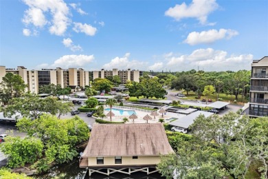 The view truly takes the cake in this stunning top-floor condo on Cove Cay Country Club in Florida - for sale on GolfHomes.com, golf home, golf lot