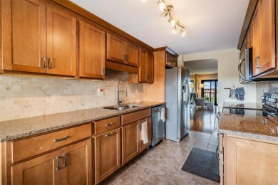 The view truly takes the cake in this stunning top-floor condo on Cove Cay Country Club in Florida - for sale on GolfHomes.com, golf home, golf lot
