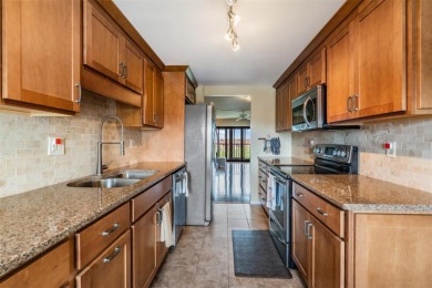 The view truly takes the cake in this stunning top-floor condo on Cove Cay Country Club in Florida - for sale on GolfHomes.com, golf home, golf lot