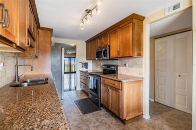 The view truly takes the cake in this stunning top-floor condo on Cove Cay Country Club in Florida - for sale on GolfHomes.com, golf home, golf lot