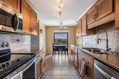 The view truly takes the cake in this stunning top-floor condo on Cove Cay Country Club in Florida - for sale on GolfHomes.com, golf home, golf lot