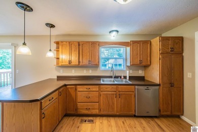 This welcoming 3-bedroom, 2-bath home sits on just over an acre on Paxton Park Golf Course in Kentucky - for sale on GolfHomes.com, golf home, golf lot