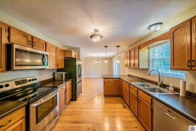 This welcoming 3-bedroom, 2-bath home sits on just over an acre on Paxton Park Golf Course in Kentucky - for sale on GolfHomes.com, golf home, golf lot