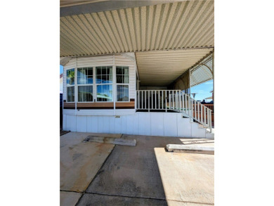 Fabulous home. Covered parking. No one behind you which gives on Riverview Golf Course in Arizona - for sale on GolfHomes.com, golf home, golf lot