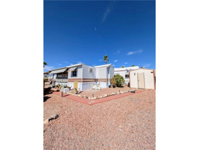 Fabulous home. Covered parking. No one behind you which gives on Riverview Golf Course in Arizona - for sale on GolfHomes.com, golf home, golf lot