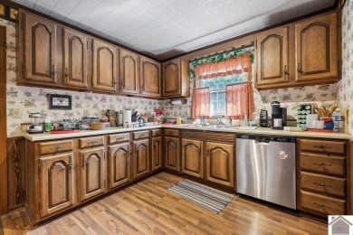 Charming three bedroom/2 bath house located in Country Club on Mayfield-Graves Country Club in Kentucky - for sale on GolfHomes.com, golf home, golf lot