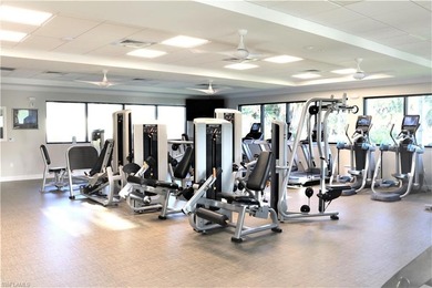 Grab a drink of your choice, head to the lanai and watch the on Royal Wood Golf and Country Club in Florida - for sale on GolfHomes.com, golf home, golf lot