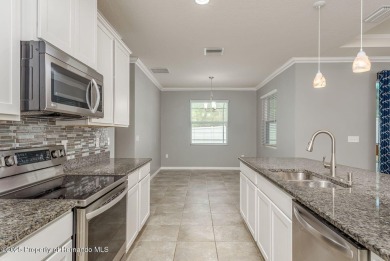 Welcome to this beautifully maintained 4-bedroom, 3.5-bathroom on Silverthorn Country Club in Florida - for sale on GolfHomes.com, golf home, golf lot
