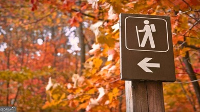 Welcome home to the amazing community of Lake Arrowhead. Nestled on The Highlands Course at Lake Arrowhead in Georgia - for sale on GolfHomes.com, golf home, golf lot