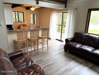 This simply sweet chalet getaway is nestled on a pretty forested on The Hideout Golf in Pennsylvania - for sale on GolfHomes.com, golf home, golf lot