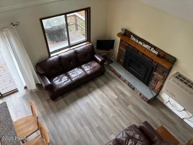 This simply sweet chalet getaway is nestled on a pretty forested on The Hideout Golf in Pennsylvania - for sale on GolfHomes.com, golf home, golf lot