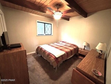 This simply sweet chalet getaway is nestled on a pretty forested on The Hideout Golf in Pennsylvania - for sale on GolfHomes.com, golf home, golf lot