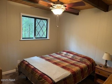 This simply sweet chalet getaway is nestled on a pretty forested on The Hideout Golf in Pennsylvania - for sale on GolfHomes.com, golf home, golf lot