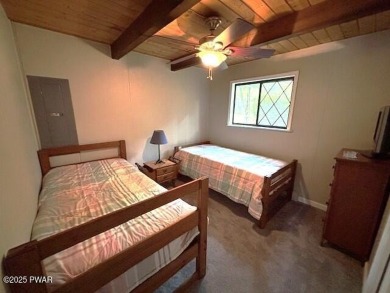 This simply sweet chalet getaway is nestled on a pretty forested on The Hideout Golf in Pennsylvania - for sale on GolfHomes.com, golf home, golf lot