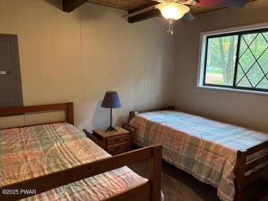 This simply sweet chalet getaway is nestled on a pretty forested on The Hideout Golf in Pennsylvania - for sale on GolfHomes.com, golf home, golf lot