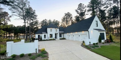 Discover modern elegance in this stunning home located in the on Reunion Golf Club in Mississippi - for sale on GolfHomes.com, golf home, golf lot