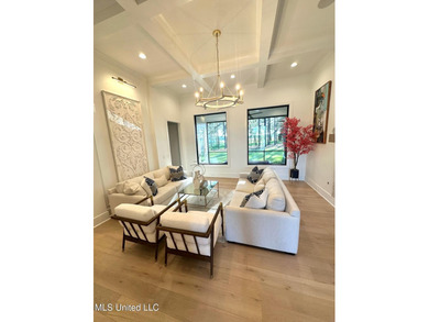 Discover modern elegance in this stunning home located in the on Reunion Golf Club in Mississippi - for sale on GolfHomes.com, golf home, golf lot