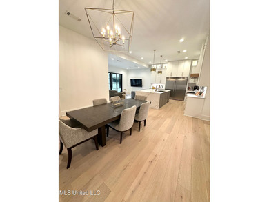 Discover modern elegance in this stunning home located in the on Reunion Golf Club in Mississippi - for sale on GolfHomes.com, golf home, golf lot