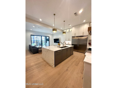 Discover modern elegance in this stunning home located in the on Reunion Golf Club in Mississippi - for sale on GolfHomes.com, golf home, golf lot