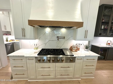 Discover modern elegance in this stunning home located in the on Reunion Golf Club in Mississippi - for sale on GolfHomes.com, golf home, golf lot